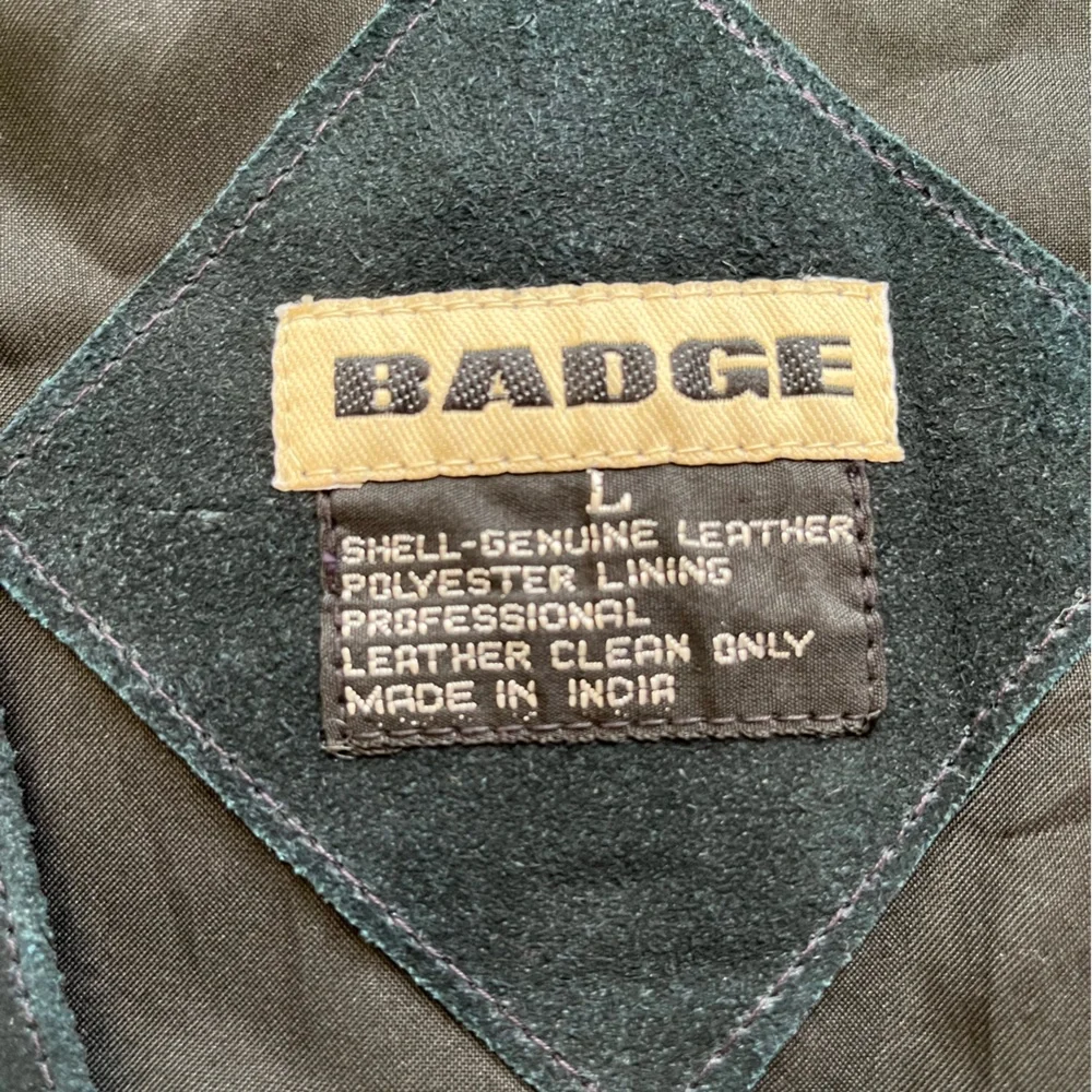 Vintage new men’s Badge blue leather suede vest with snap closure. Size large.